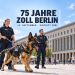 KI-generierte Illustration zu 75 Jahre Zoll Berlin 2026 mit Zoll-Diensthund, Einsatzbeamten und Zollfahrzeug vor dem Bundesfinanzministerium